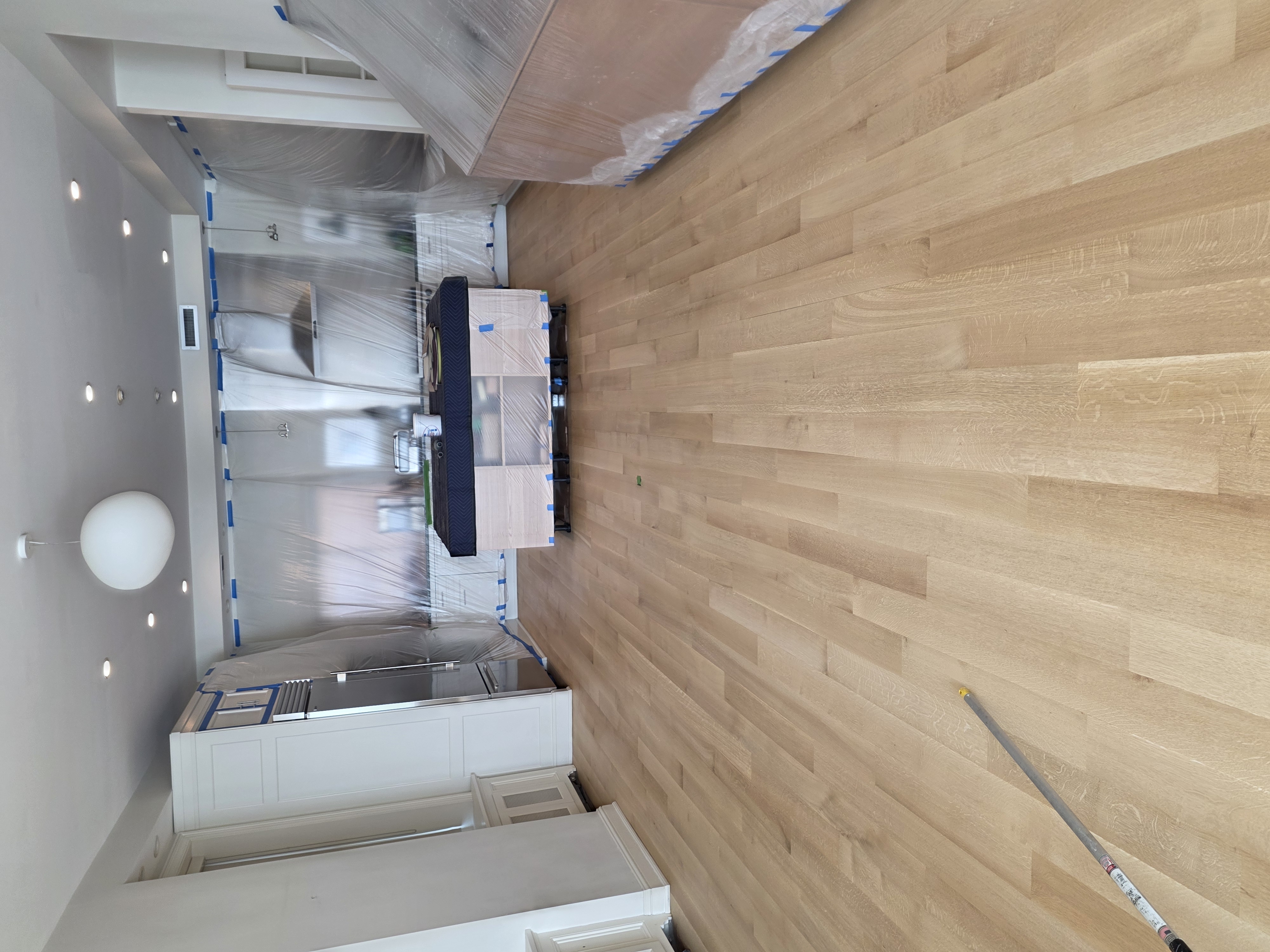 Kitchen floor refinishing with light oak finish