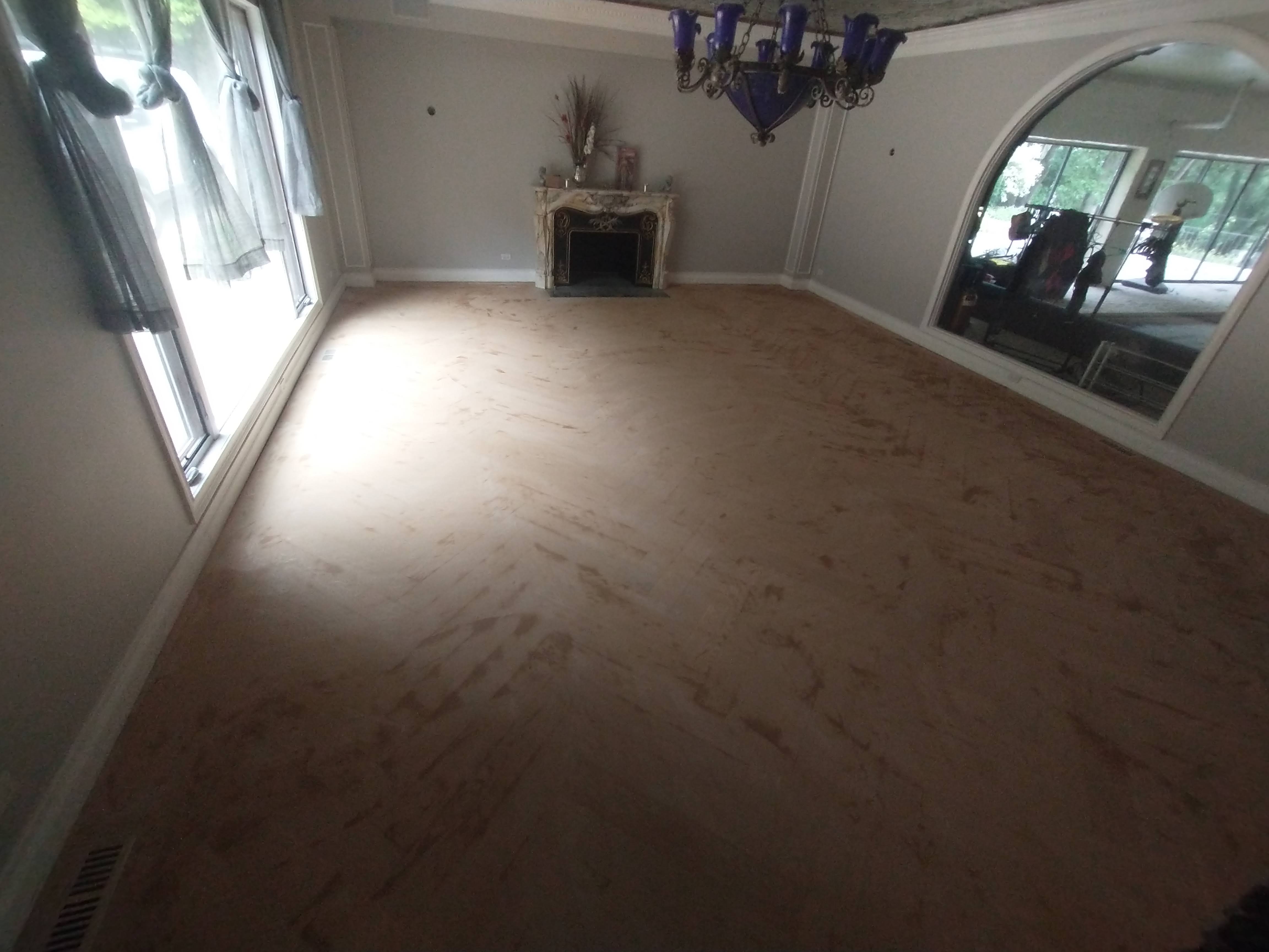Before refinishing - raw wood floor